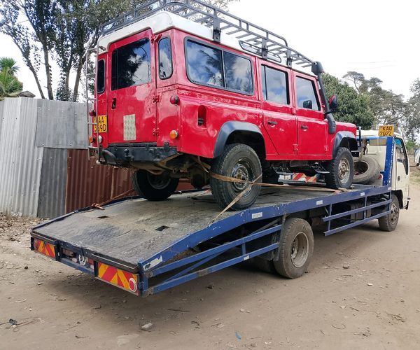 Professional accident recovery team managing crash scene in Kenya